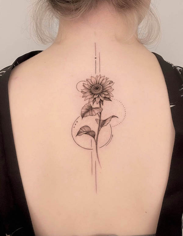 Geometric sunflower back tattoo by @maro_ink