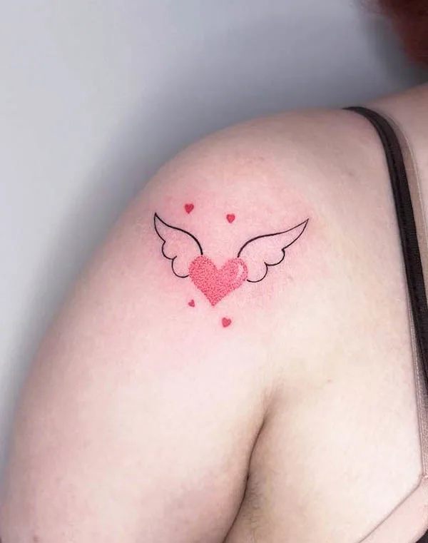 Heart with wings shoulder tattoo by @envylines