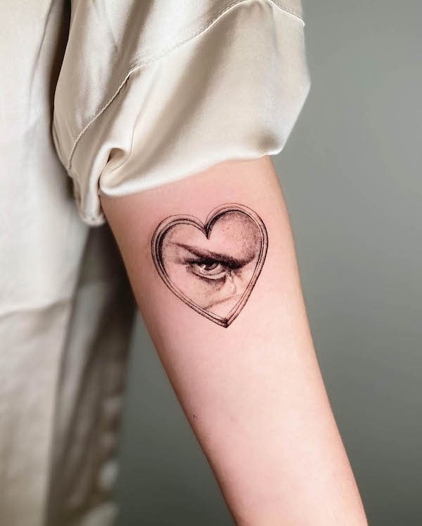 Heart-shaped fallen angel tattoo by @jardin.de.sam