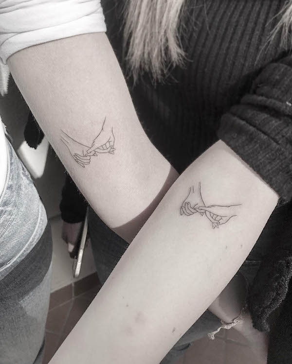 Holding hands tattoo by @moonchild.tattoo