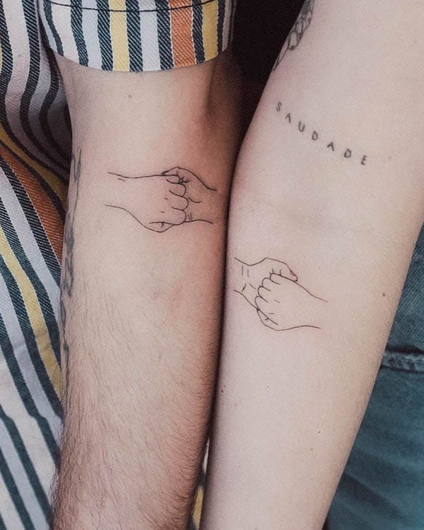 Holding hands tattoo by @tavi_tattoo