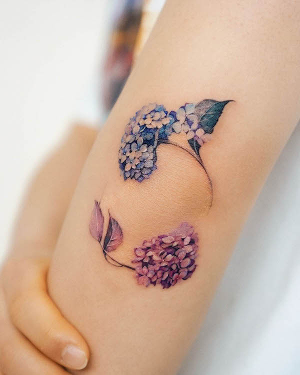 Hydrangea around the elbow by @abii_tattoo