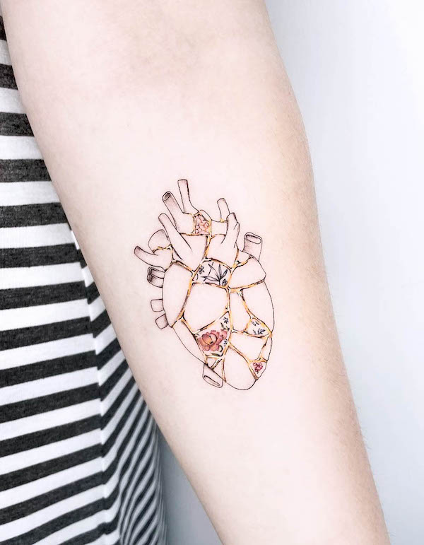 Intricate kintsugi heart tattoo by @stefania.camelia