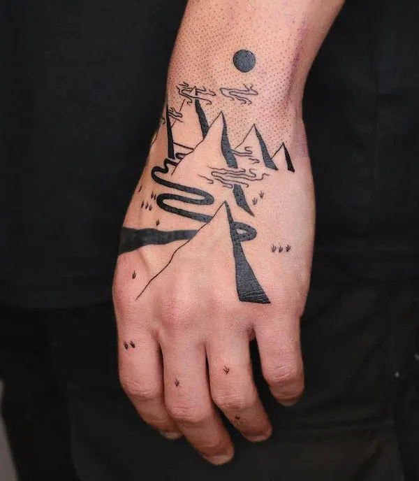 Intricate mountain hand tattoo by @zik_tats