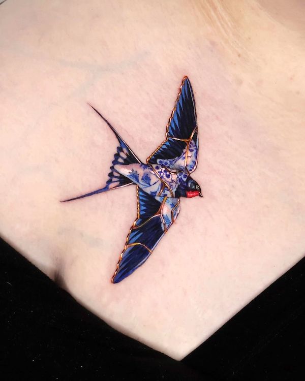 Kintsugi swallow tattoo by @tattooist_irae2