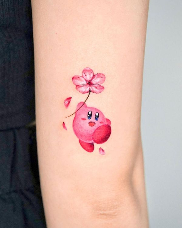 Kirby star and cherry blossom tattoo by @o.ri_tattoo