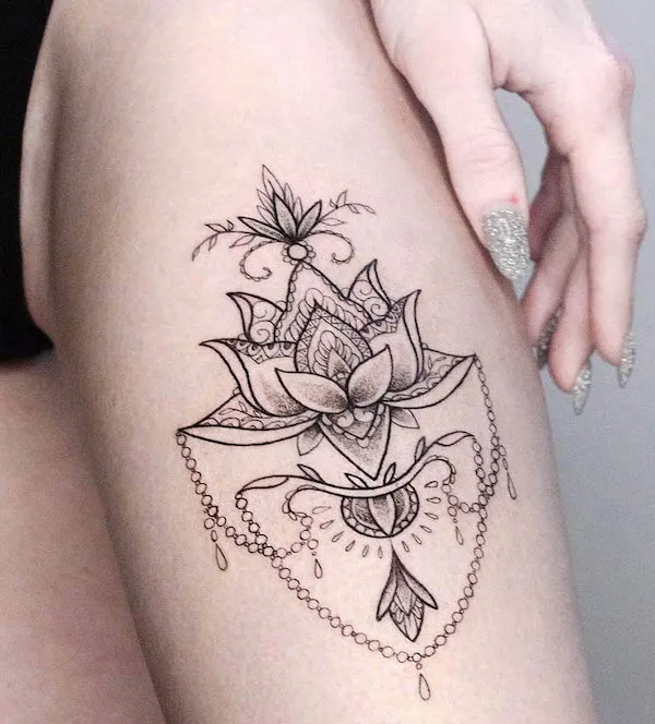 Lotus mandala thigh tattoo by @napalm_tattoo