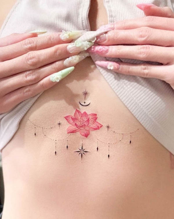 Lotus ornamental sternum tattoo by @e.hyang_.tattoo