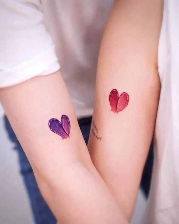 Matching artistic heart tattoos by @o.ri_tattoo