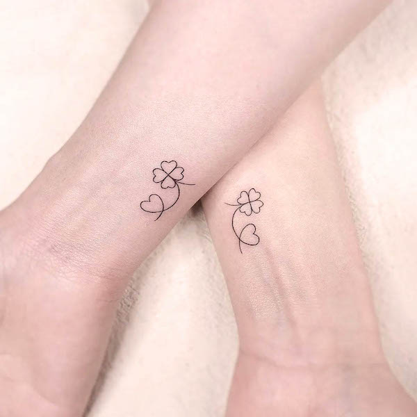 Matching clover and heart tattoos by @gorae_tattoo