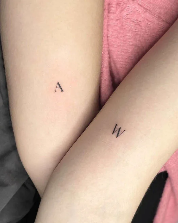 Matching initial tattoos for best friends by @yungtalie