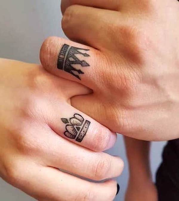 Matching king and queen ring finger tattoos by @john_martin_tattoo