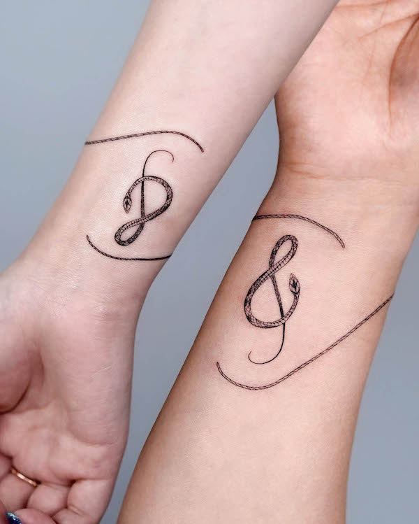 Matching music tattoos by @bium_tattoo