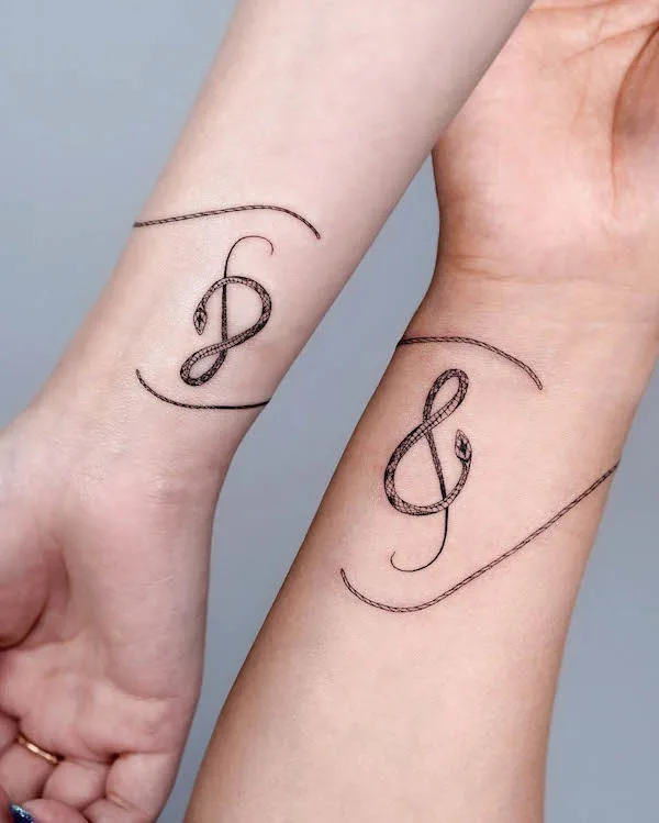 Matching music tattoos by @bium_tattoo