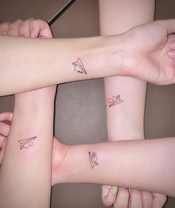 Matching plane best friend tattoos by @ziv_tattooer