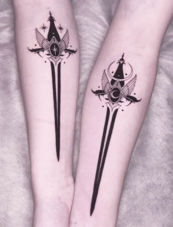 Matching star and moon dagger tattoos by @izabela.borowiak