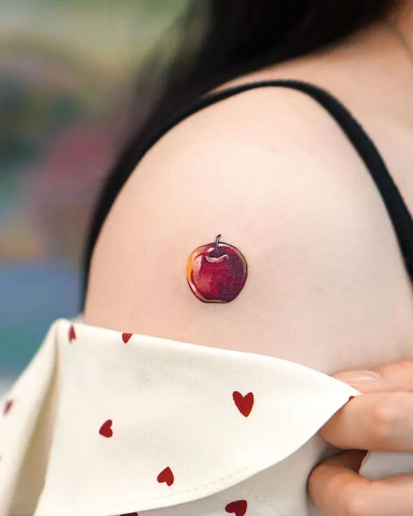 Microrealism apple tattoo by @eden_tattoo_