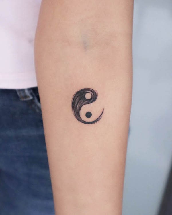 Minimalist yin yang tattoo by @zenspace_tattoostudio