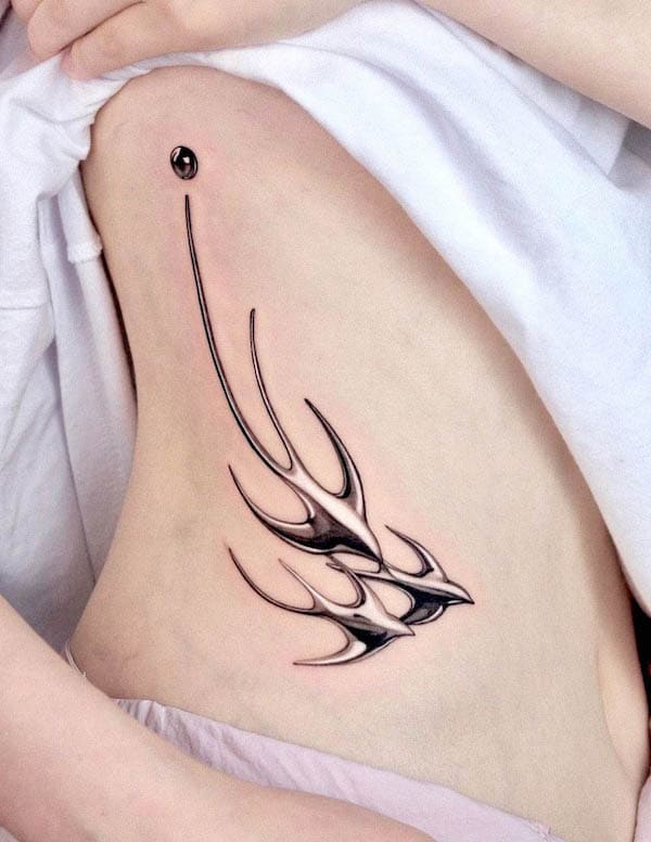 Monochrome metallic swallows by @shooin.tattoo