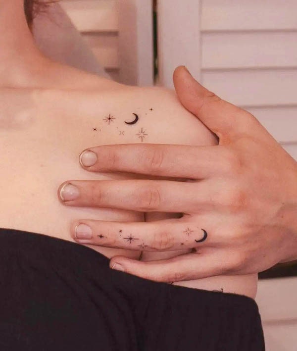 Moon and stars matching tattoos for couple by @tavi_tattoo