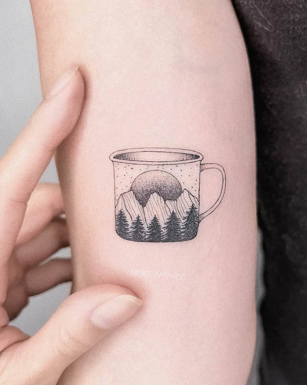 Mountains in a cup tattoo by @inkedwithco