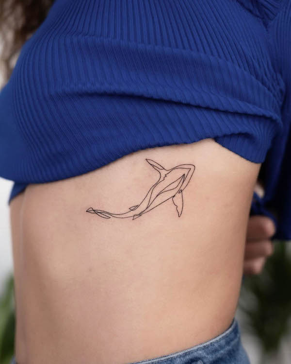 One-line shark tattoo on the rib by @berkayerkul