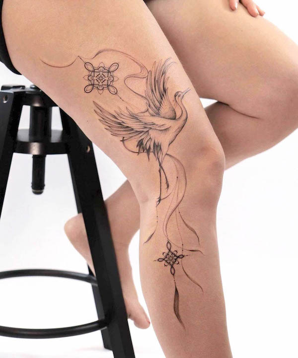 Oriental crane full leg tattoo for women by @monochrom.ink