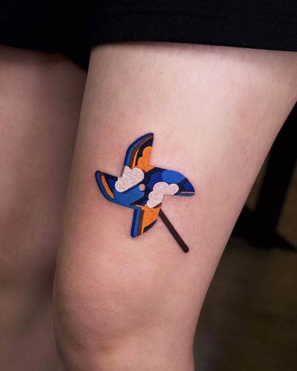 Origami windmill thigh tattoo by @zoonmo