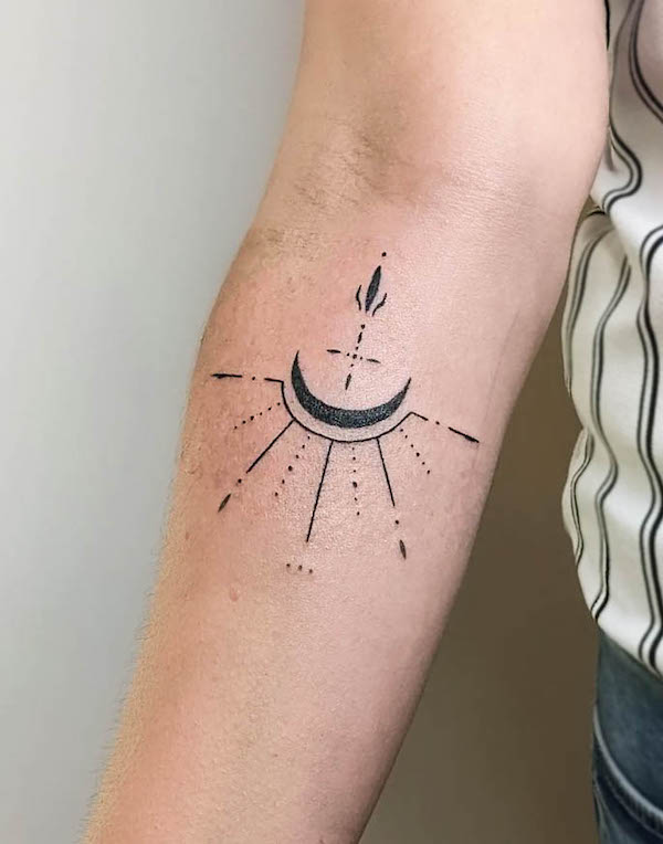 Ornamental sun and moon forearm tattoo by @ohm_relic_handpoke