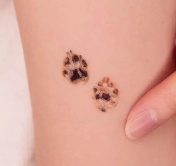 Paws tattoo by @tattxxist