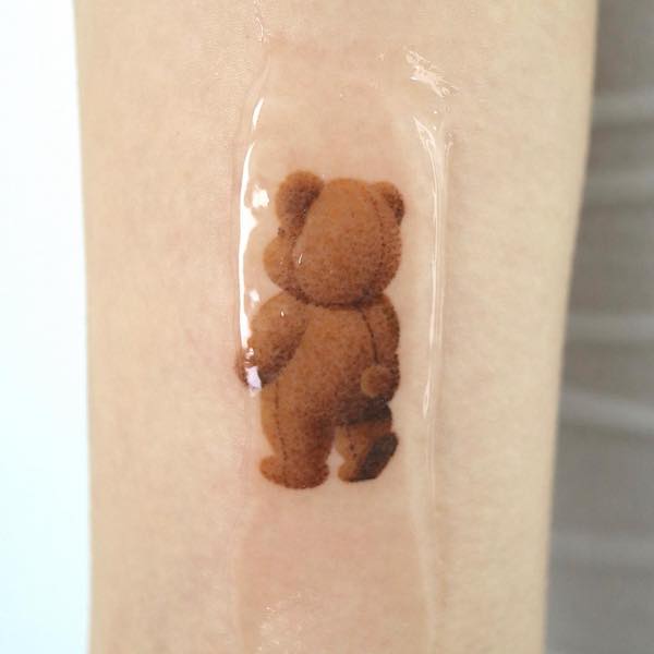 Micro-realism teddy bear tattoo by @baekya._.poke_