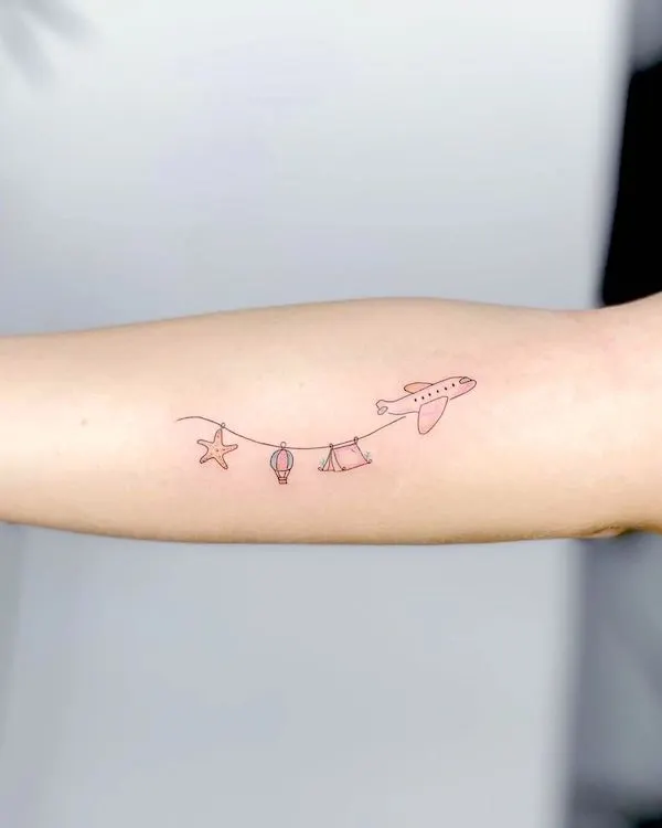 Plane tattoo for travelers by @berivanis.tatts