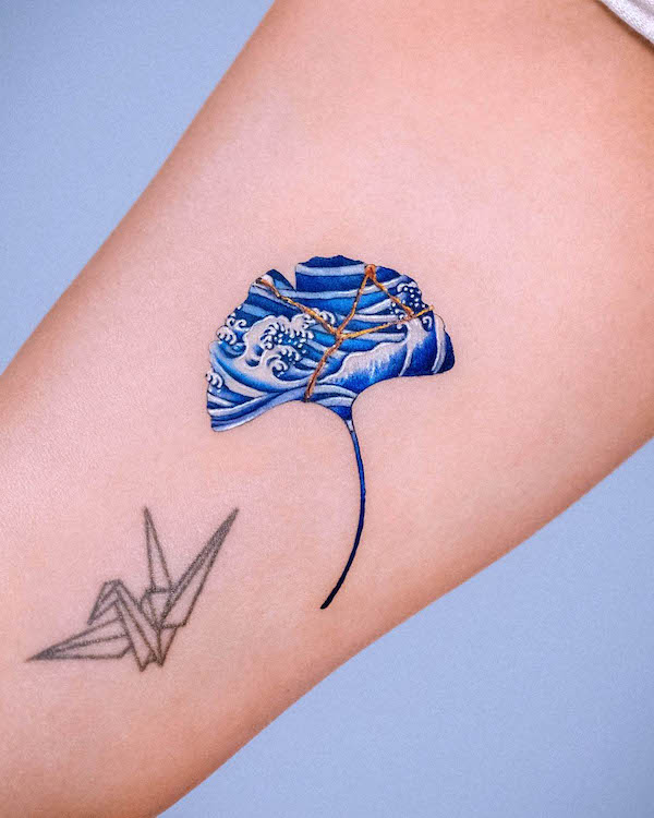 Porcelain ginkgo leaf kintsugi tattoo by @e.nal_.tattoo