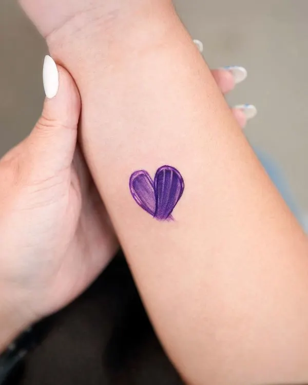 Purple heart wrist tattoo by @o.ri_tattoo