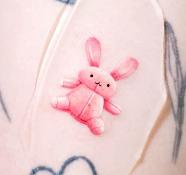 Realism plush toy rabbit tattoo by @eins_tattooer