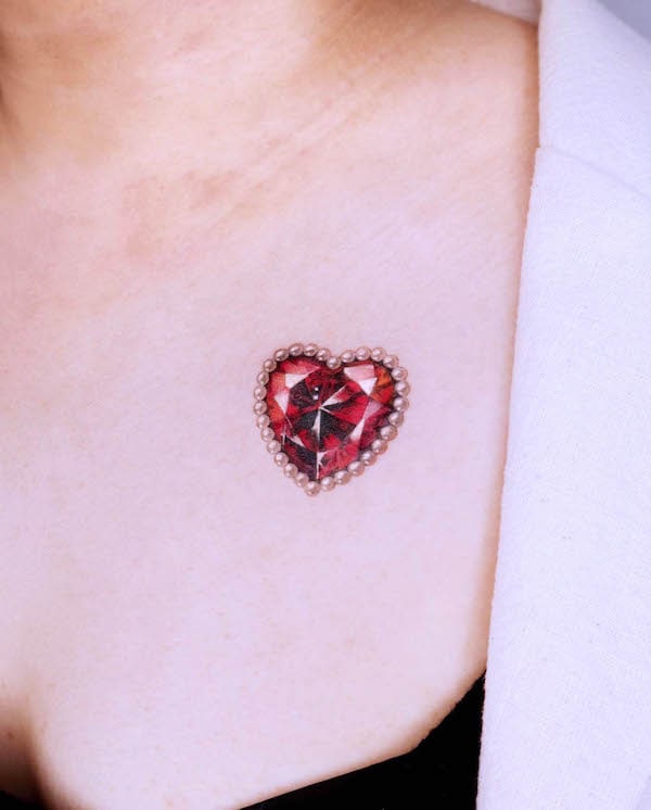 Red diamond heart tattoo by @tattooist_siia