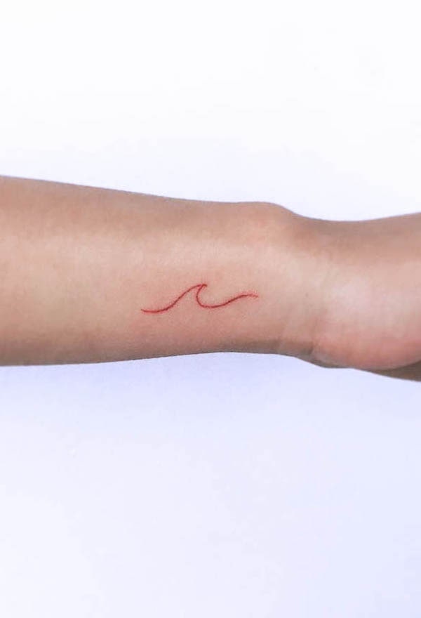 Red wave wrist tattoo by @tattoobyok