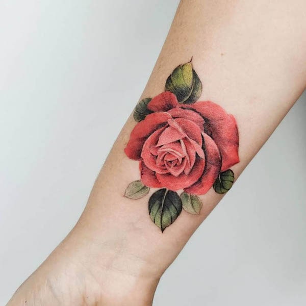 Rose symbolic love tattoo by @dreamhandstattoostudio