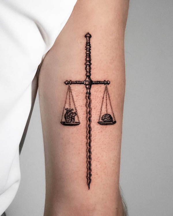 Scale sword tattoo by @ygtattoos