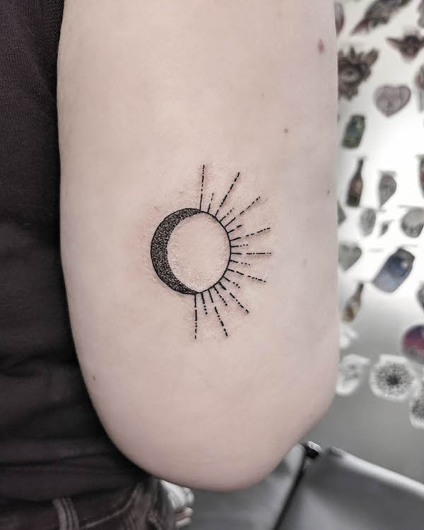 Simple merging sun and moon tattoo by @debs_tattoo