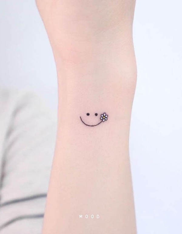 Simple smile on the wrist tattoo by @mood_bkk