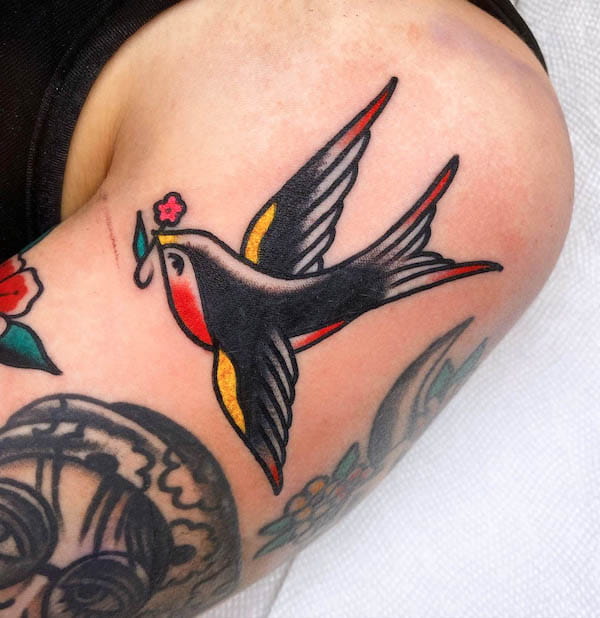 Small and cute traditional swallow tattoo by @batsforbrains