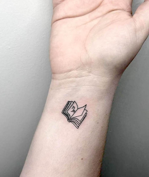 Small book and zodiac sign tattoo by @browlouiejenn