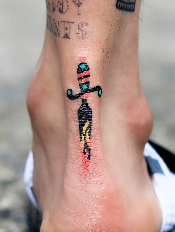 Small contemporary dagger tattoo by @zzizziboy