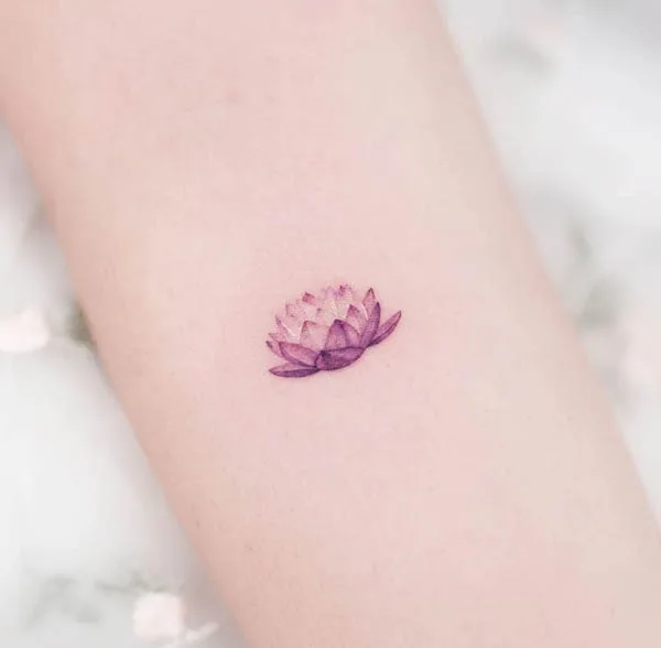 Small cute lotus tattoo by @tattoo.haneul