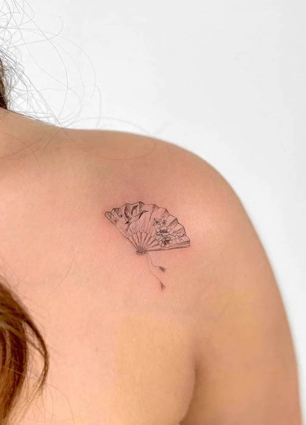 Small cute paper fan tattoo by @emilyjtattoos