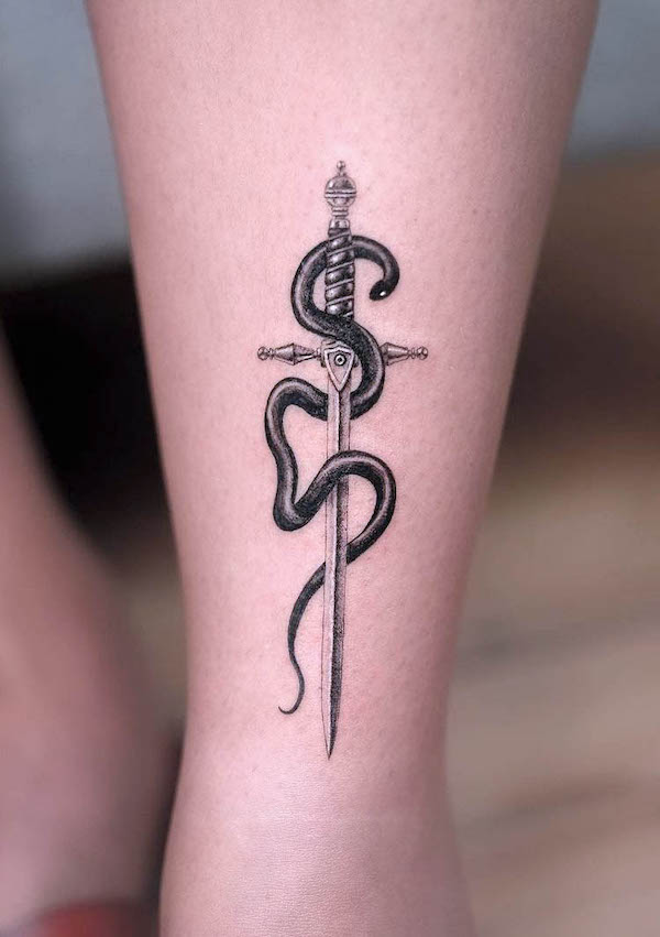 Small dagger with snake tattoo by @ricardogtattoo