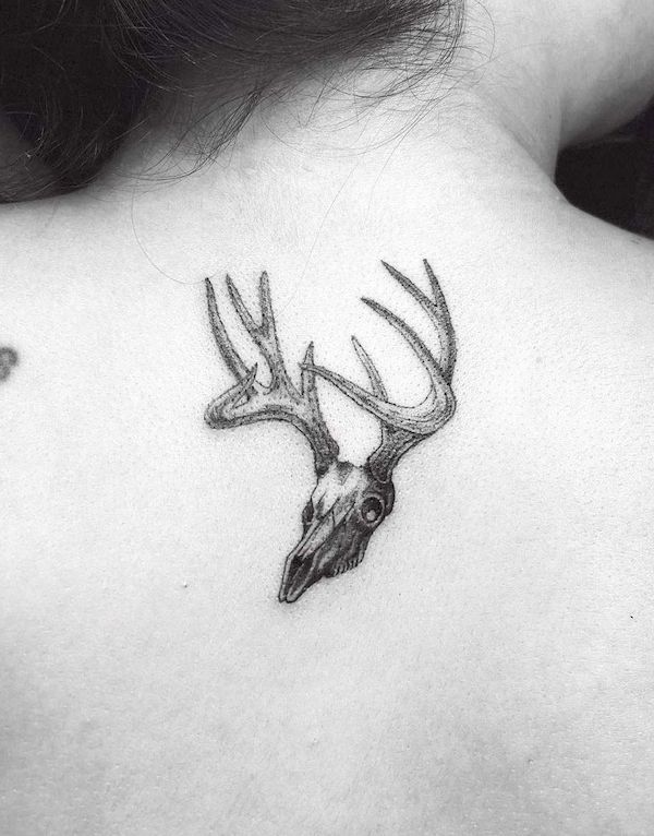 Small deer skull back tattoo by @gracesnightmares