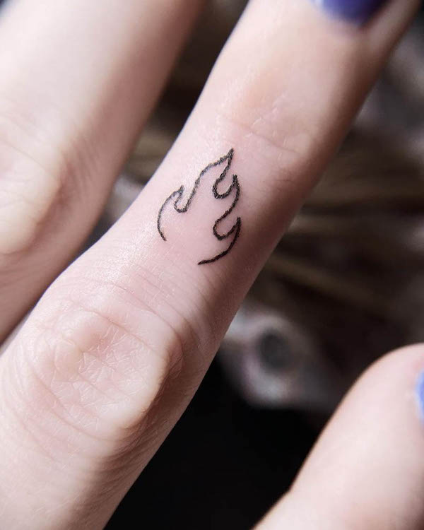 Small fire finger tattoo by @nashvilletinytattoos