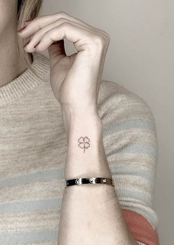 Small four-leaf clover wrist tattoo by @tattoobychang